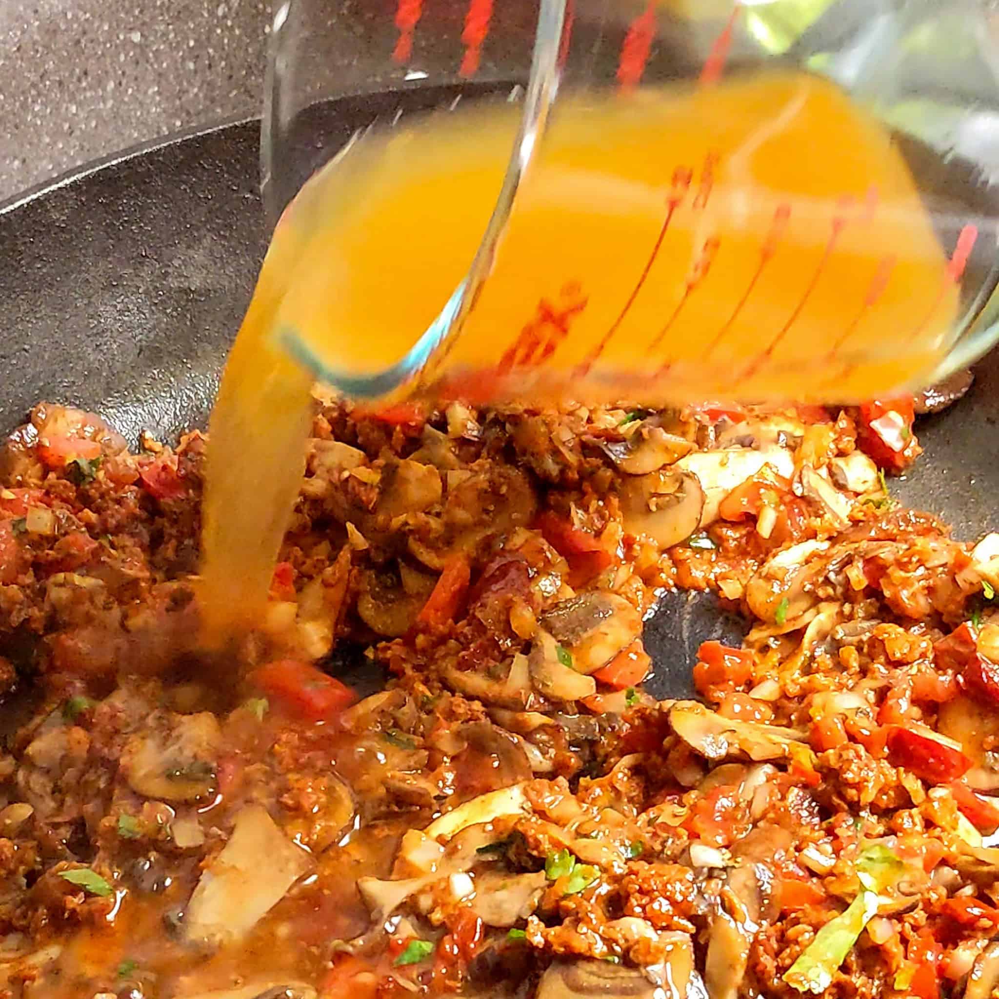 vegetable broth added to the Vegetarian Birria mushroom mixture.